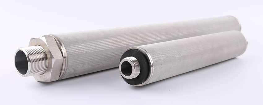 Two stainless steel sintered filter cartridges lying on the white background.